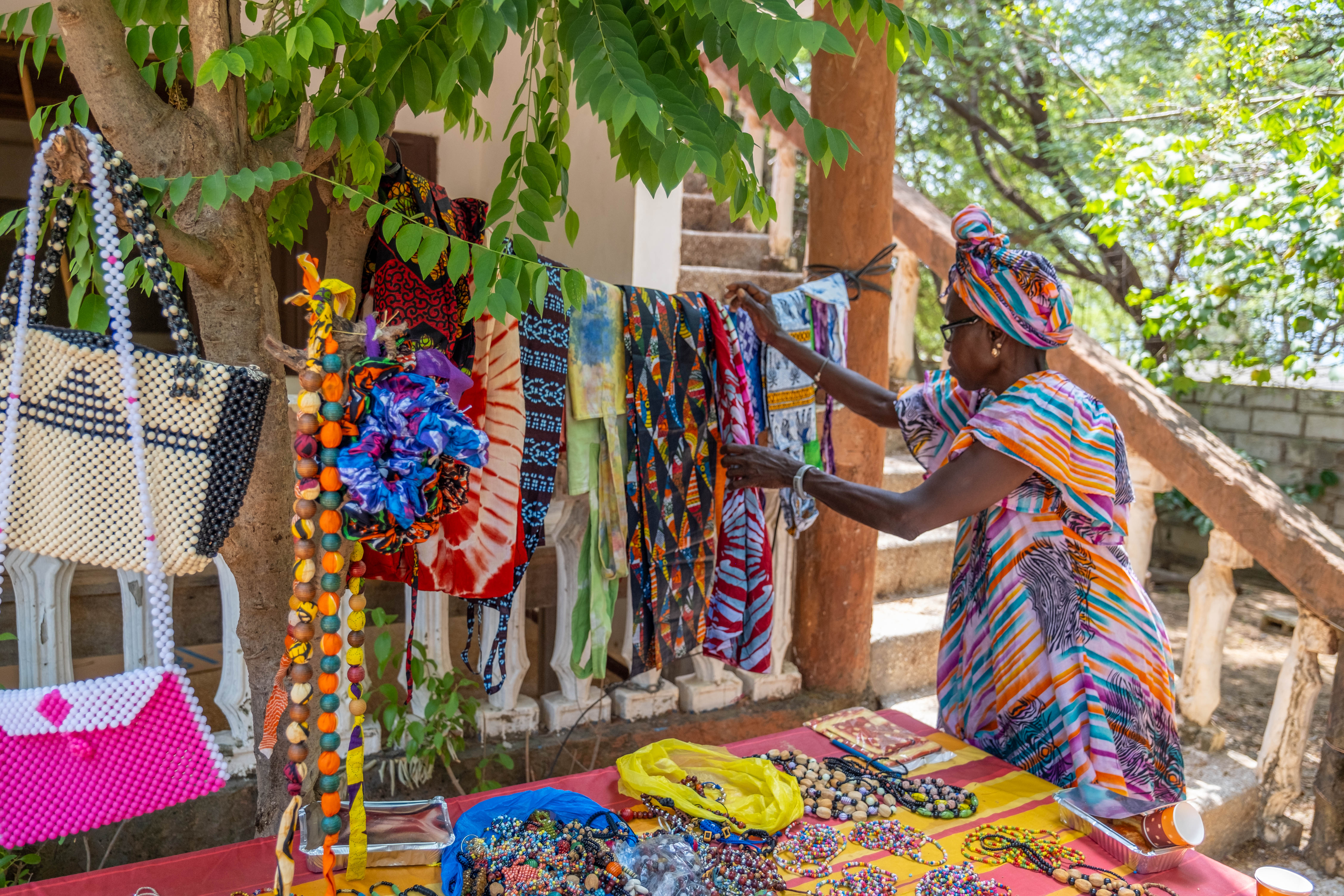 Woman selling hand-made products in Africa